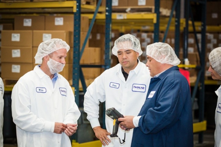 Utah AG Sean Reyes, center, tours the Twinlab manufacturing plant in Utah.  Twinlab photo.