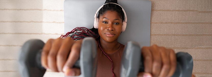 Woman lifting weights at home