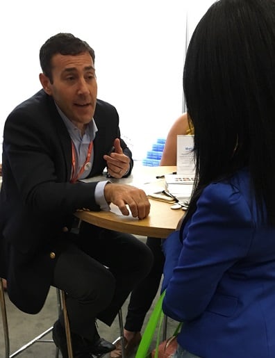 Duffy-MacKay-offering-wellness-advice-to-blogger-stopping-by-CRN-s-booth-at-BlogHer-16.jpg