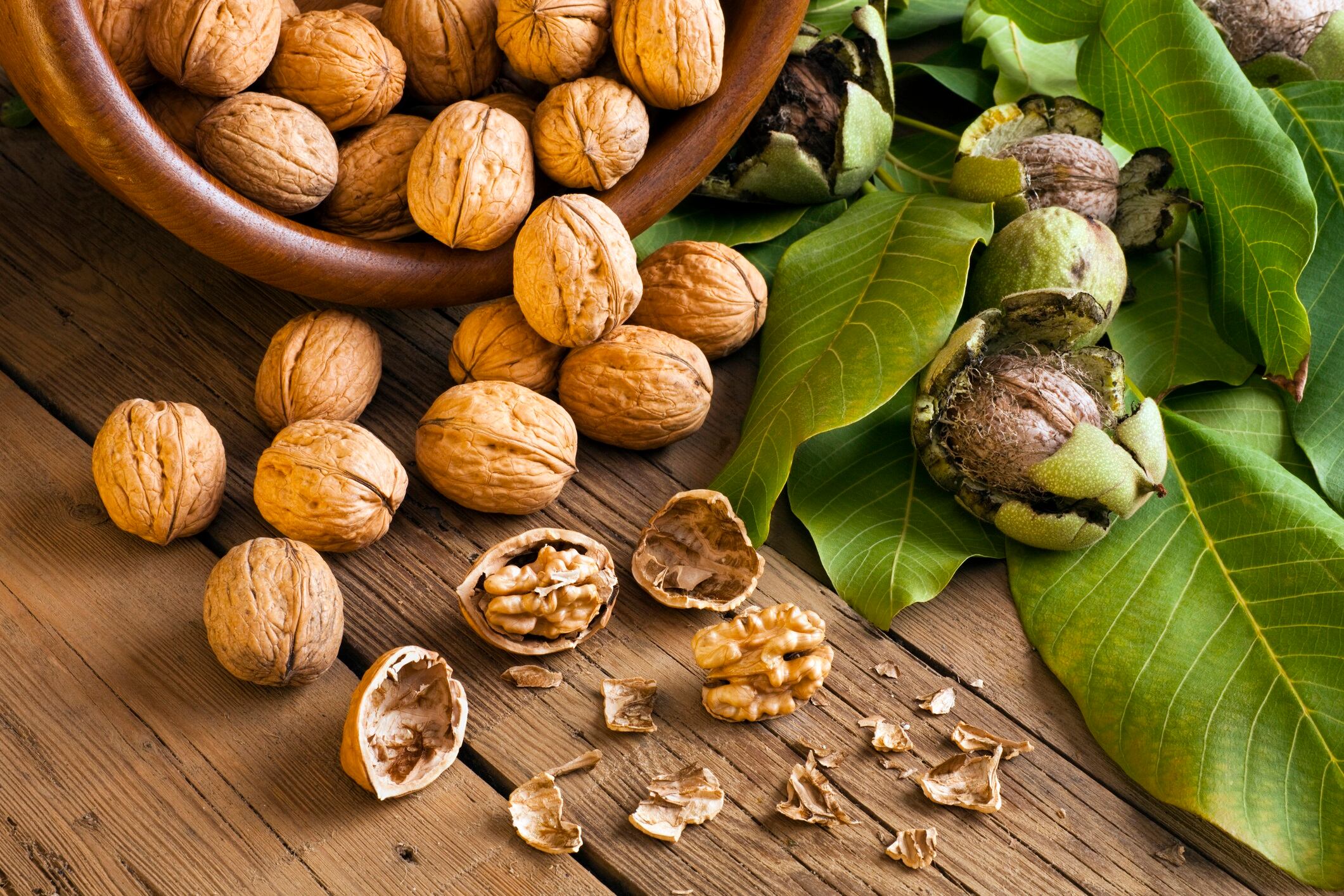 Walnuts on wooden table.