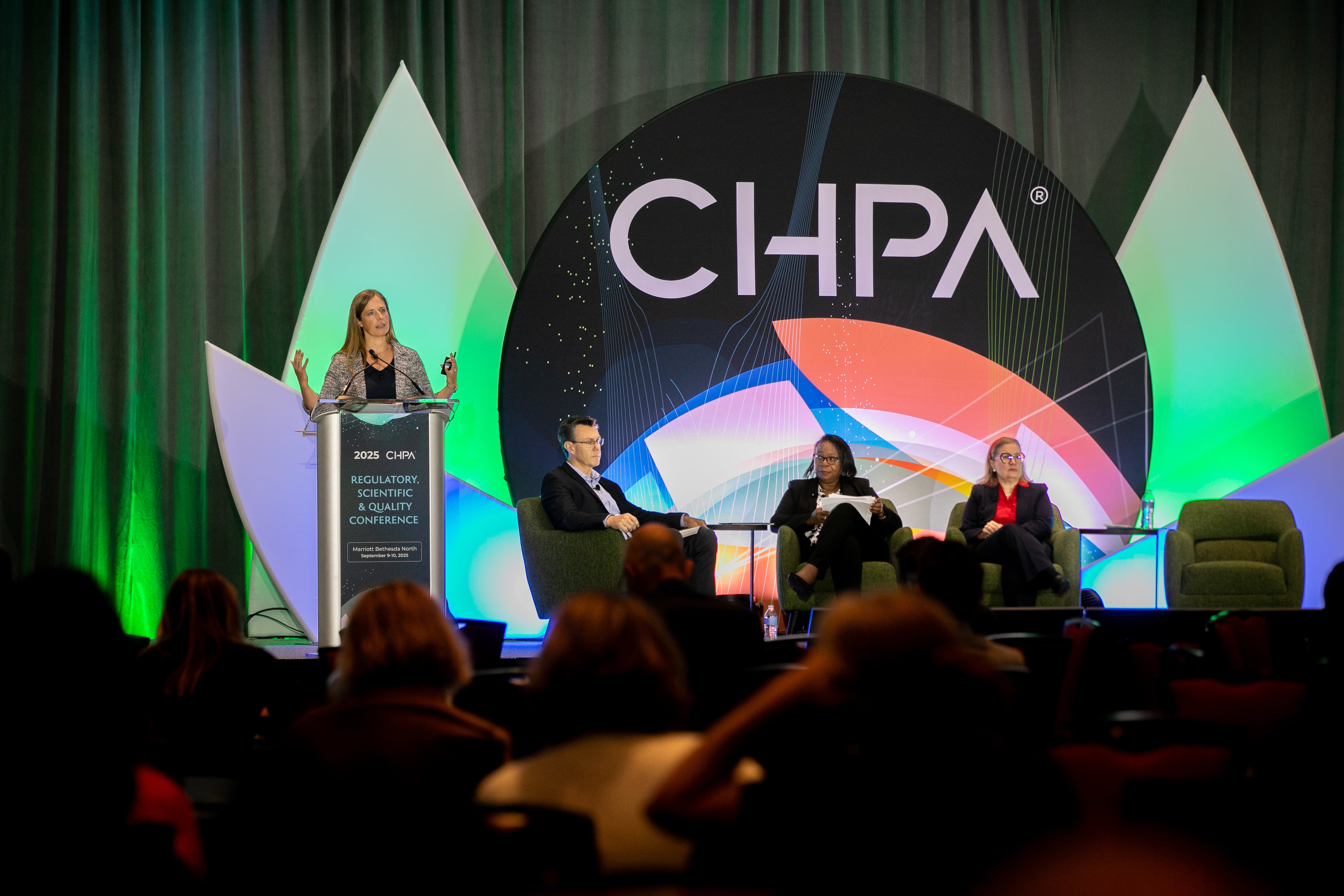 Cara Welch, PhD on stage at the CHPA RSQ in Bethesda, MD.