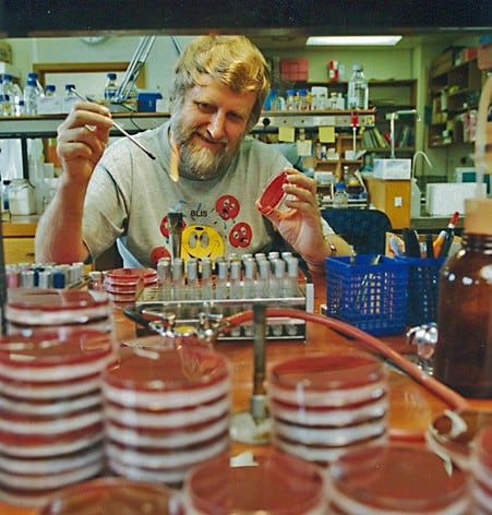 Archive image of Professor John Tagg, founder of BLIS Technologies, in the lab