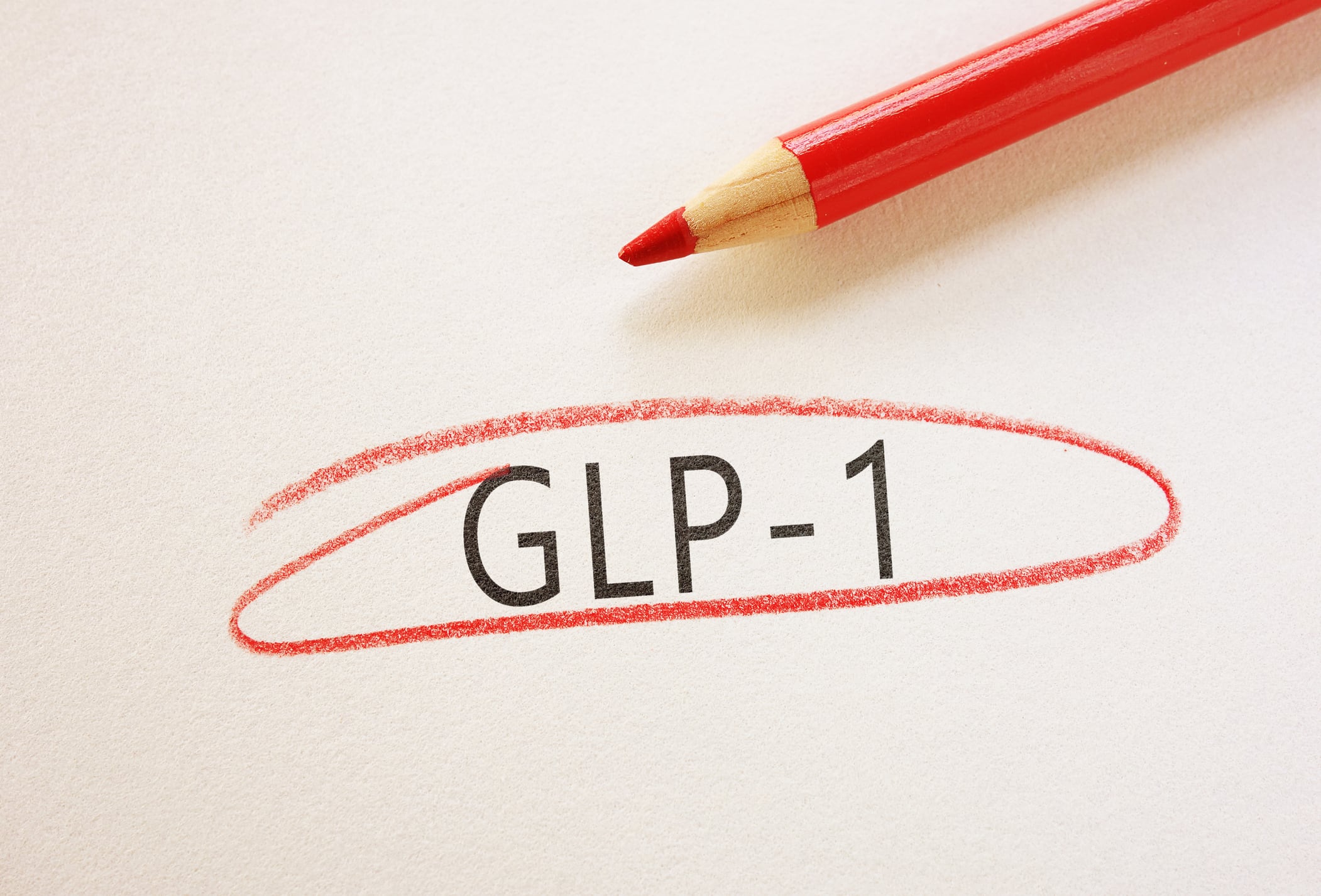 GLP-1 text circled in red pencil on textured paper