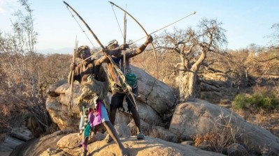 Hadza men with bows and arrows. The Hadza are an indigenous ethnic group in north-central Tanzania, and are among the last hunter-gatherers in the world.   Image © Katiekk2 / Getty Images 