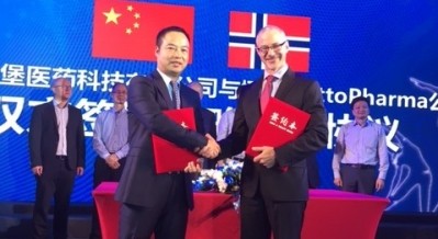 Youwen Chen, FishBurg CEO and Daniel Rosenbaum, NattoPharma CEO pictured after signing the deal.